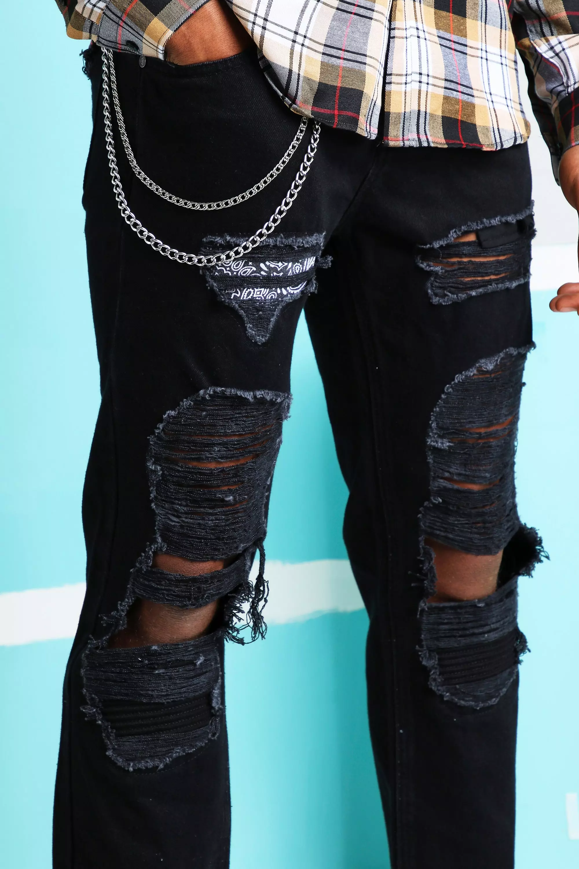 Black ripped jeans with hot sale chain